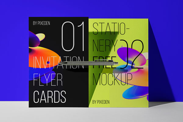 2 Flyers Mockup Standing Against the Wall with a Pen