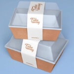 2 Mockups Featuring Take-away Food Container with Paper Band