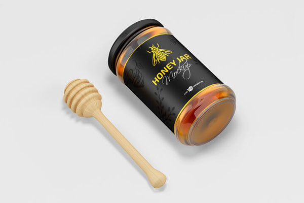 2 Mockups of Glass Honey Jar with Wooden Dipper