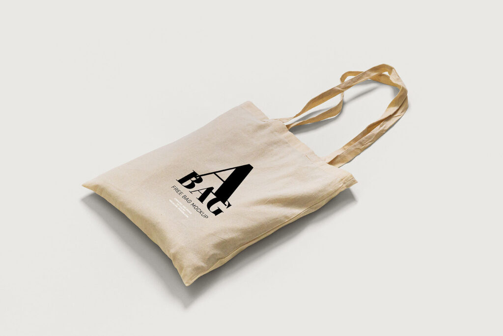2 Mockups of Tote Bag Laid in Top and Perspective Views