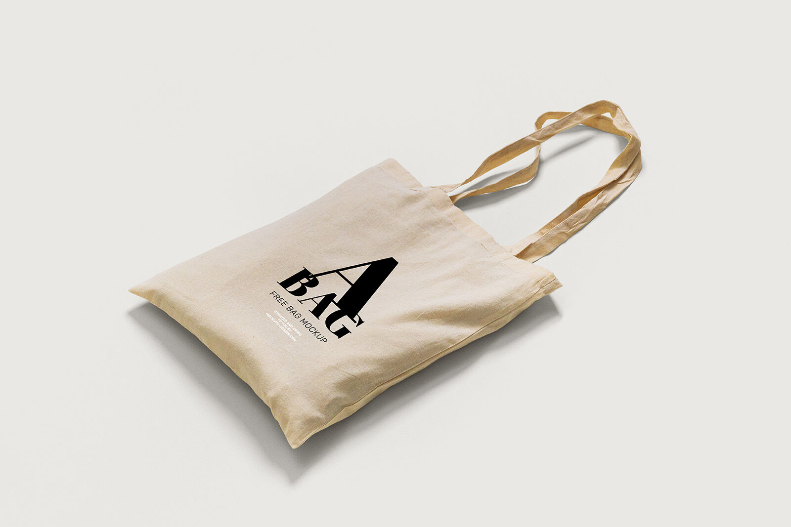 2 Mockups of Tote Bag Laid in Top and Perspective Views FREE PSD