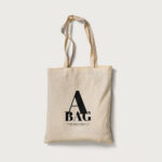 2 Mockups of Tote Bag Laid in Top and Perspective Views