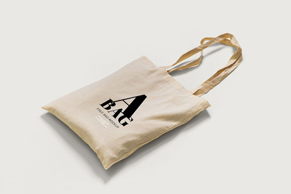 2 Mockups of Tote Bag Laid in Top and Perspective Views
