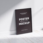 2 Poster Frame Mockups Laid on the Wall