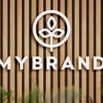 2 Shots of Logo Mockup on Wooden Panels