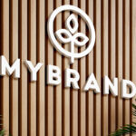 2 Shots of Logo Mockup on Wooden Panels