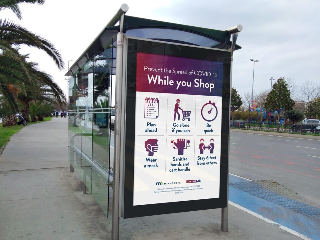 3/4 View Bus Stop Advertising Poster Mockup in Urban Setting