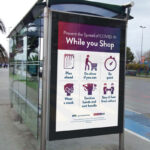 3/4 View Bus Stop Advertising Poster Mockup in Urban Setting