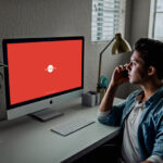 3/4 View Developer Using iMac Mockup Scene