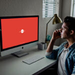 3/4 View Developer Using iMac Mockup Scene