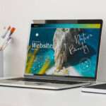 3/4 View Laptop on Table Mockup with Eiffel Tower Figurine