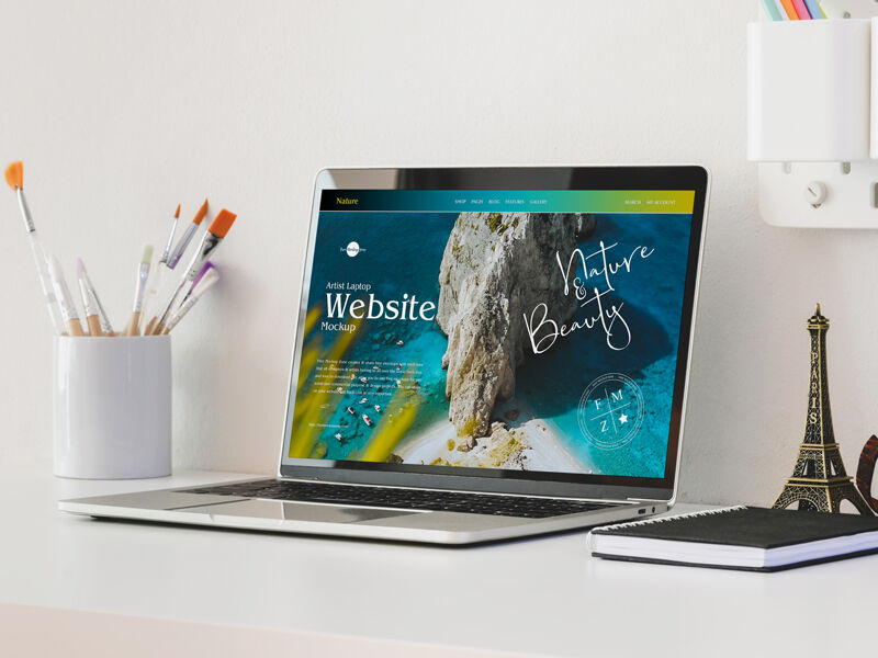 3/4 View Laptop on Table Mockup with Eiffel Tower Figurine
