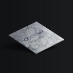 3/4 View of a Square Coaster With an Engraved Logo Mockup