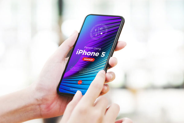 3/4 View Person Using iPhone 5 Mockup