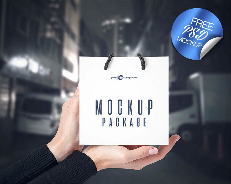 3 Front-View Mockups of a Square Paper Bag in Hand