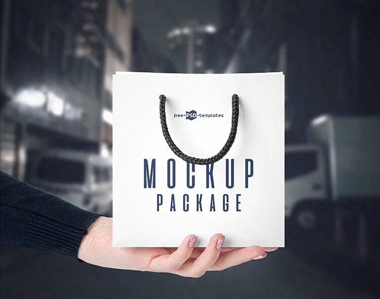 3 Front-View Mockups of a Square Paper Bag in Hand