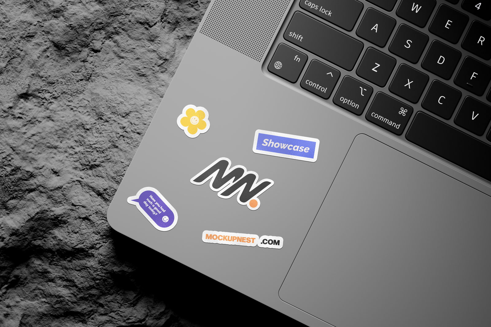 Free 3 Shots of Laptop Sticker Mockup on Rock PSD Template