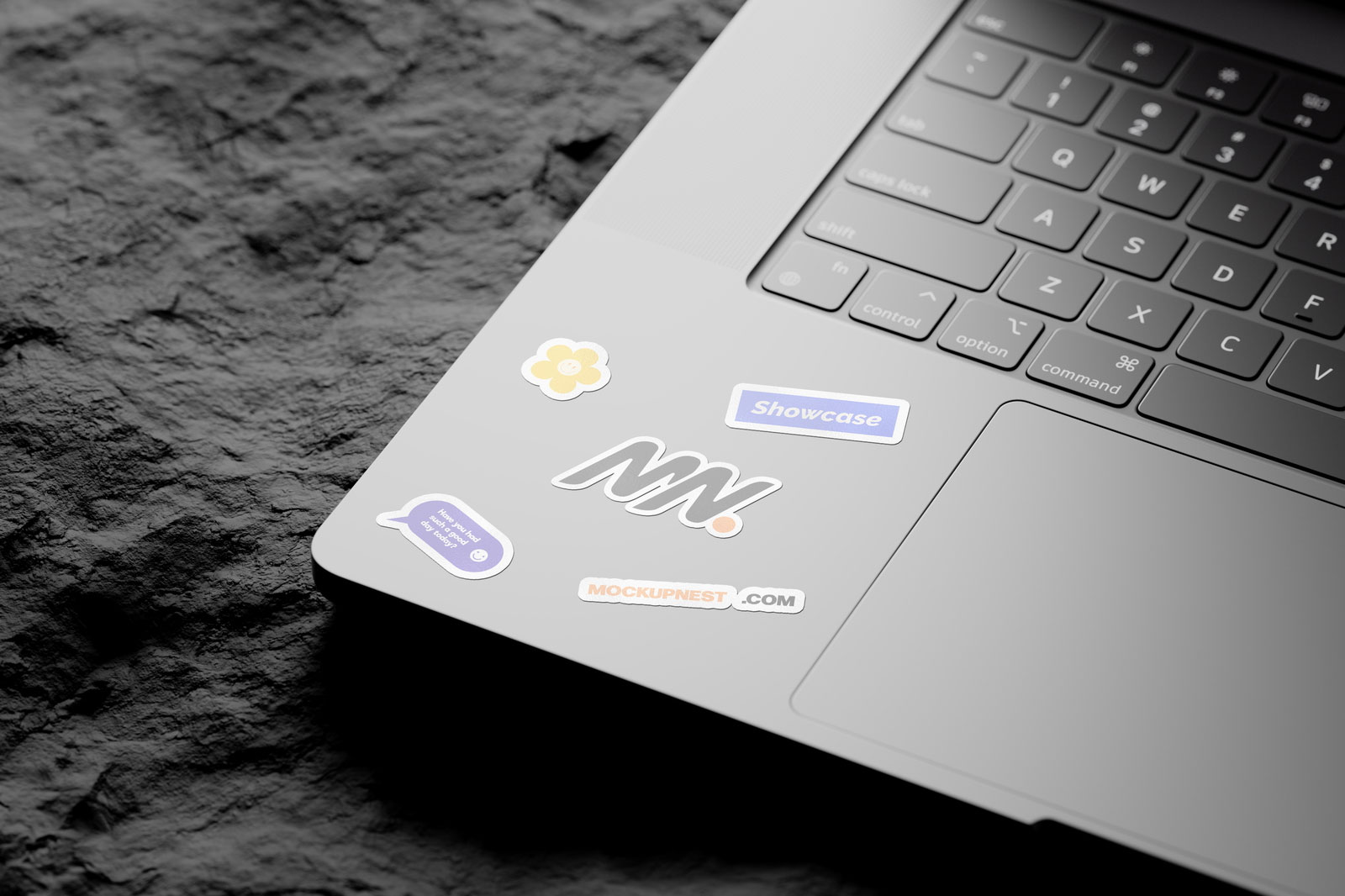 Free 3 Shots of Laptop Sticker Mockup on Rock PSD Template