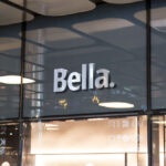 3D Silver Logo on a Glassy Facade Shop Mockup