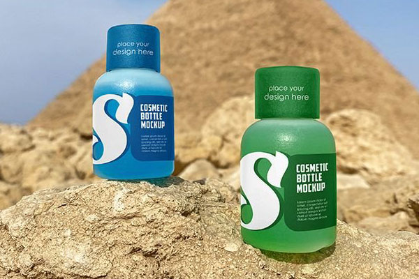 4 Shots of Small Cosmetic Bottle Mockup in Desert
