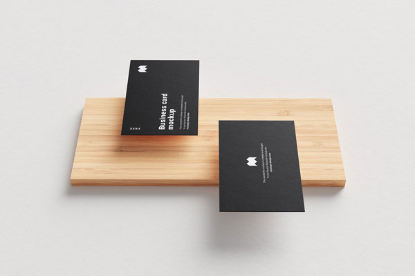 5 Mockups of Floating Business Cards Along with a Wooden Board