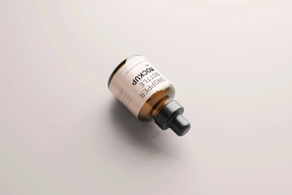 5 Mockups of Stubby Dropper Bottle in Varied Shots