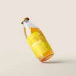 5 Orange Juice Bottle Mockups in Varied Visions