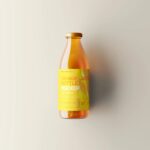 5 Orange Juice Bottle Mockups in Varied Visions