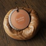 5 Round Keychain Mockup with Leather Pillow in Various Views mockup preview