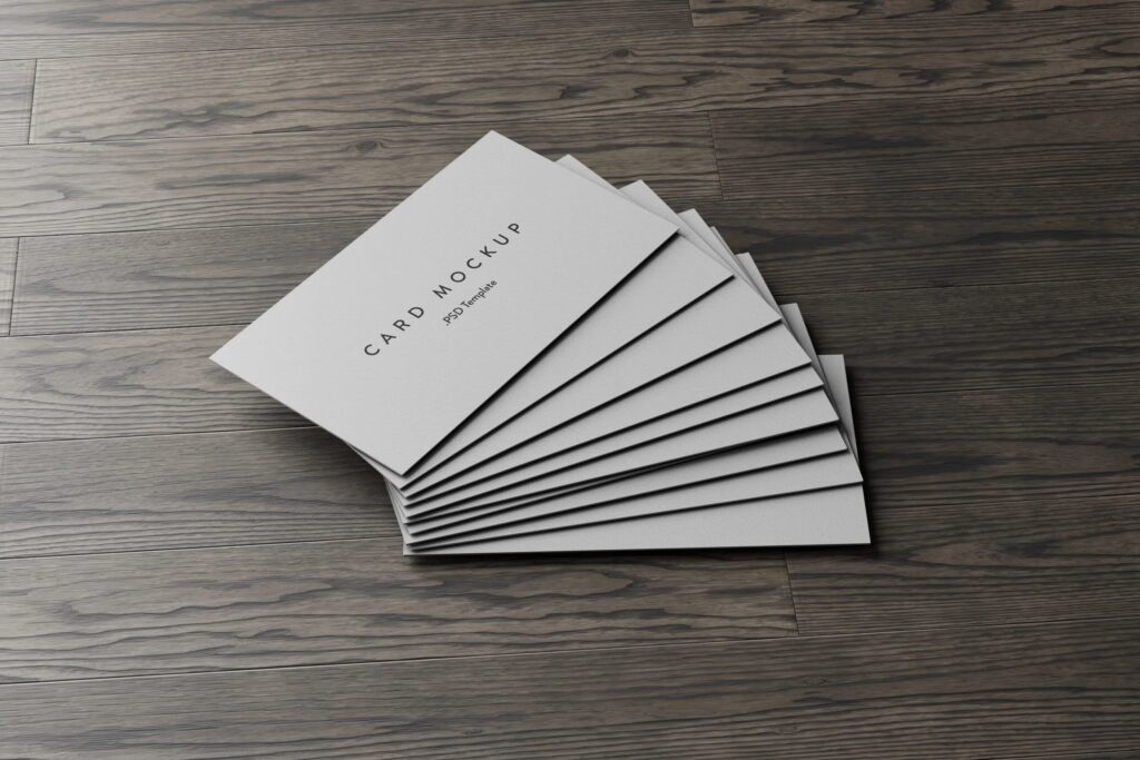 7 Business Cards Mockups Stack on Wood Background