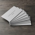 7 Business Cards Mockups Stack on Wood Background