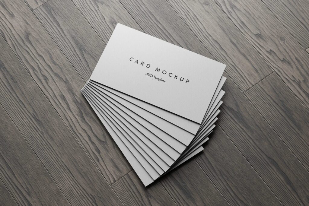 7 Business Cards Mockups Stack on Wood Background