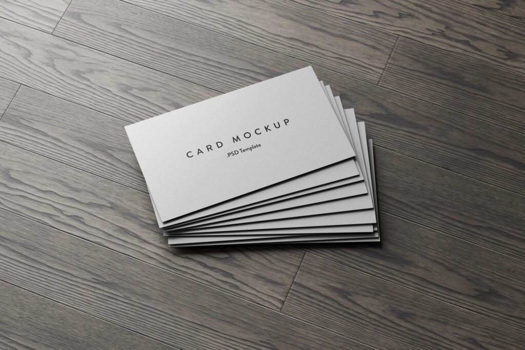 7 Business Cards Mockups Stack on Wood Background