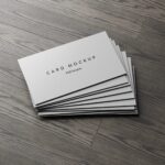 7 Business Cards Mockups Stack on Wood Background