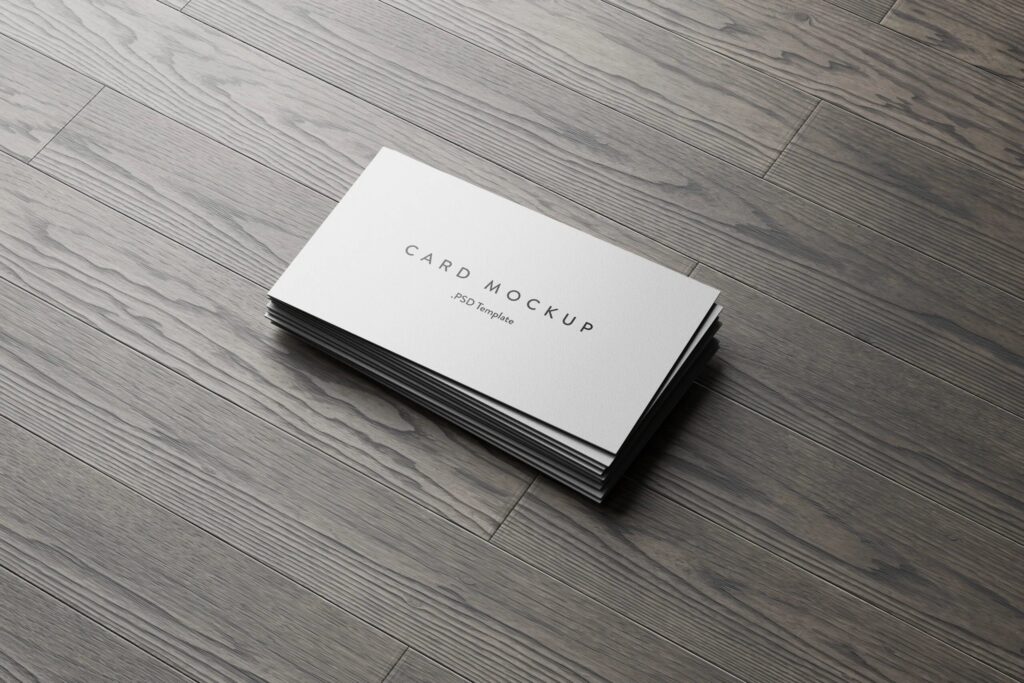 7 Business Cards Mockups Stack on Wood Background