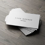 7 Business Cards Mockups Stack on Wood Background