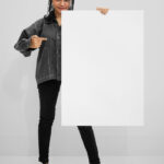 A Front View of a Women Holding Poster Mockup