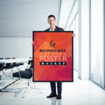 A Man Holding a Poster in an Office Mockup