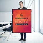 A Man Holding a Poster in an Office Mockup