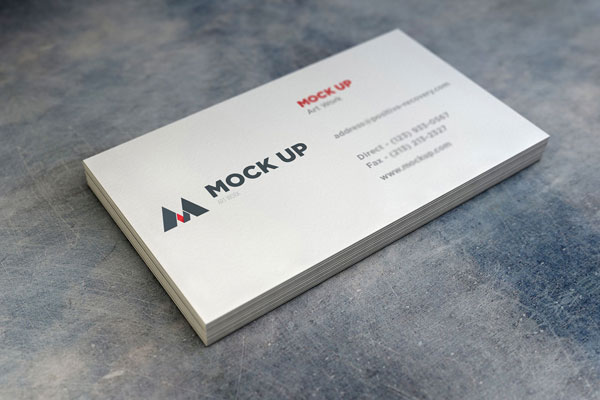 A Sack of Realistic Business Cards on a Stone Texture Mockup