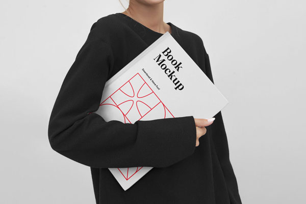 A Woman Holding a Book Mockup