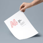 A4 Paper in a Hand Mockup