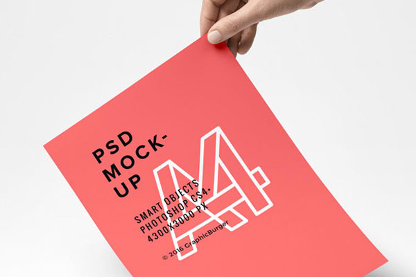 A4 Paper in a Hand Mockup