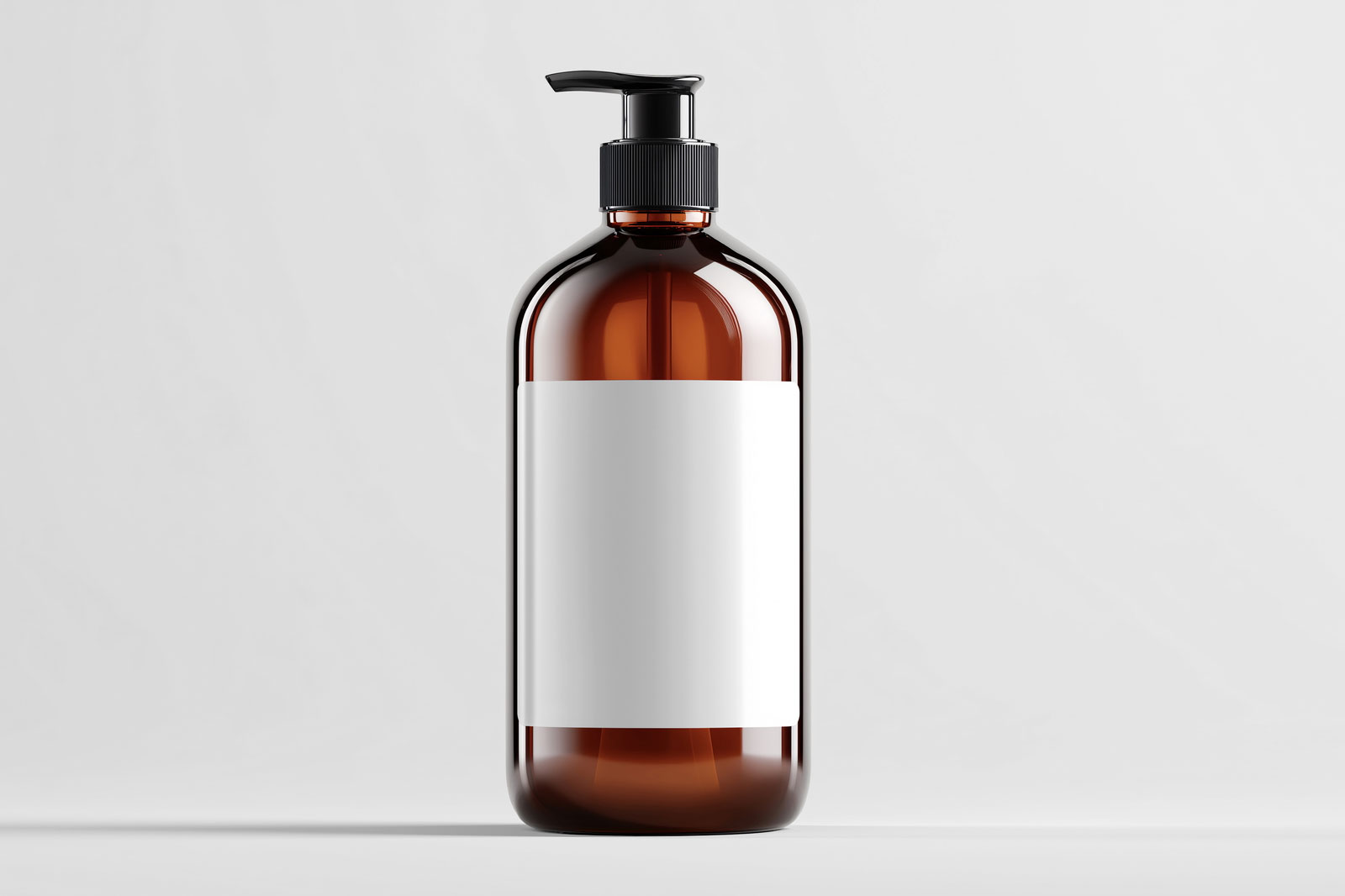 Free Amber Cosmetic Bottle Mockup in Studio Light PSD Template