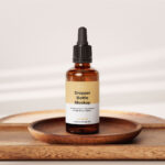 Amber Essential Bottle Mockup in 4 Showcases