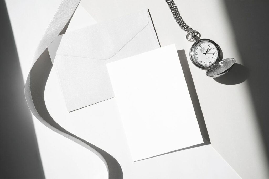 Angled Top View of an Envelope Mockup with Card and Watch