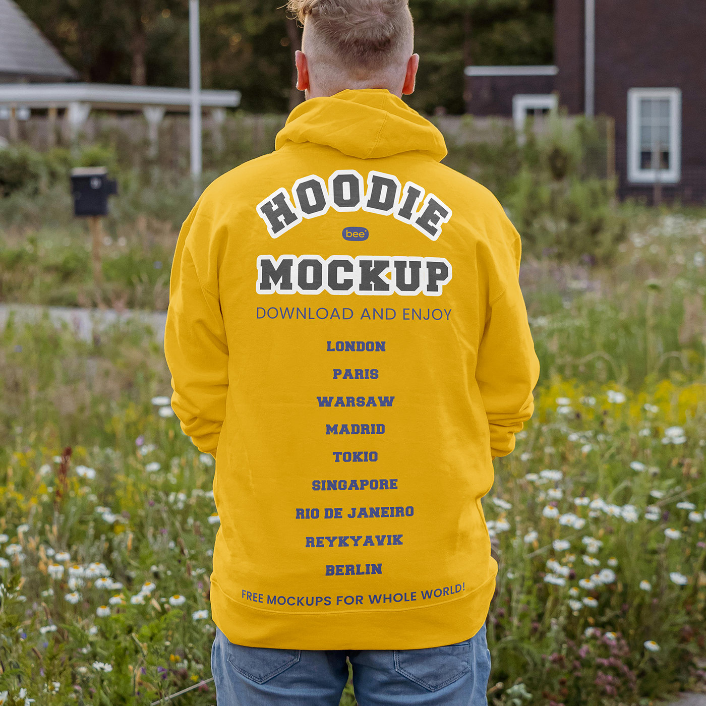 Back View of Man Wearing Oversize Hoodie Mockup in Garden FREE PSD