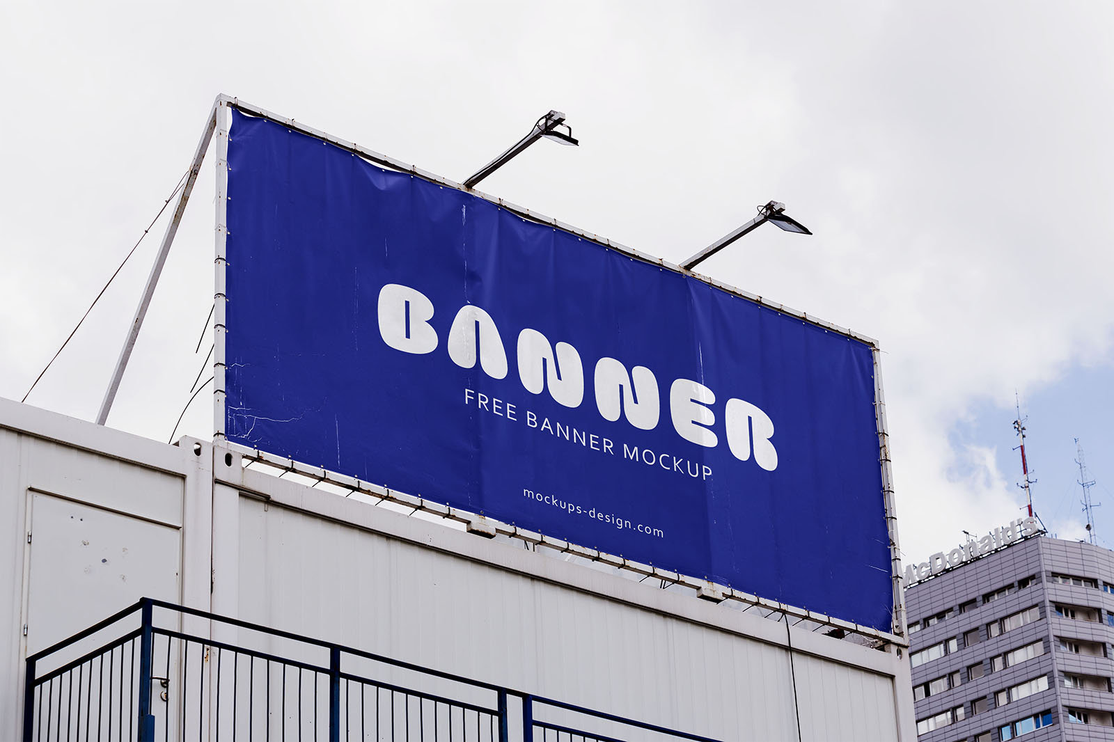 Banner on Top of the Building Mockup from Low-Angle Shot FREE PSD