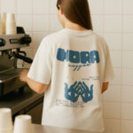 Barista T-Shirt Mockup in Cafe
