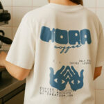 Barista T-Shirt Mockup in Cafe